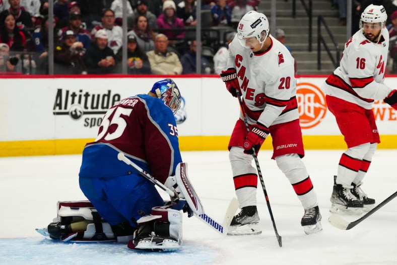 Apr 16, 2022; Denver, Colorado, USA; Carolina Hurricanes center Sebastian Aho (20) attempts to score on Colorado Avalanche goaltender Darcy Kuemper (35) in the first period at Ball Arena. Mandatory Credit: Ron Chenoy-USA TODAY Sports
