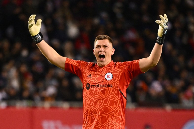 Apr 16, 2022; Chicago, Illinois, USA;  Chicago Fire FC goalkeeper Gaga Slonina (1) revs up the crowd in the second half against the LA Galaxy at Soldier Field. Chicago Fire FC and LA Galaxy played to a 0-0 tie. Mandatory Credit: Jamie Sabau-USA TODAY Sports