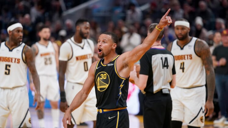 Apr 16, 2022; San Francisco, California, USA; Golden State Warriors guard Stephen Curry (30) interacts with fans after a foul call against the Denver Nuggets in the third quarter during game one of the first round for the 2022 NBA playoffs at the Chase Center. Mandatory Credit: Cary Edmondson-USA TODAY Sports