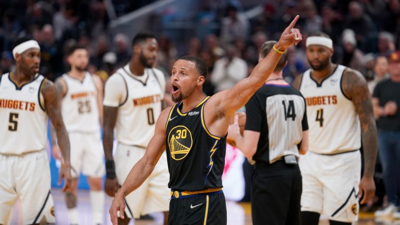 Apr 16, 2022; San Francisco, California, USA; Golden State Warriors guard Stephen Curry (30) interacts with fans after a foul call against the Denver Nuggets in the third quarter during game one of the first round for the 2022 NBA playoffs at the Chase Center. Mandatory Credit: Cary Edmondson-USA TODAY Sports