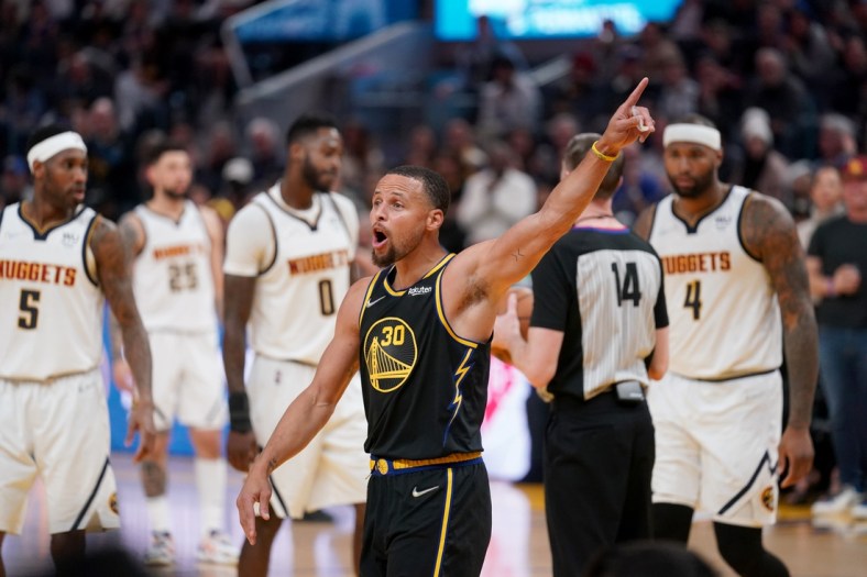 Apr 16, 2022; San Francisco, California, USA; Golden State Warriors guard Stephen Curry (30) interacts with fans after a foul call against the Denver Nuggets in the third quarter during game one of the first round for the 2022 NBA playoffs at the Chase Center. Mandatory Credit: Cary Edmondson-USA TODAY Sports
