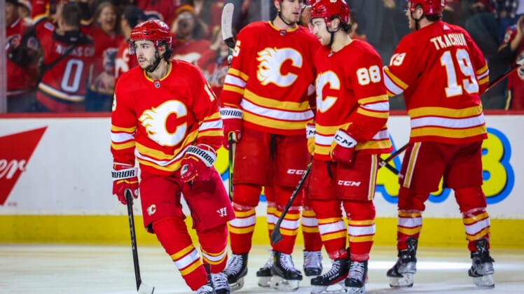 Apr 16, 2022; Calgary, Alberta, CAN; Calgary Flames left wing Johnny Gaudreau (13) celebrates his goal with teammates against the Arizona Coyotes during the third period at Scotiabank Saddledome. Mandatory Credit: Sergei Belski-USA TODAY Sports