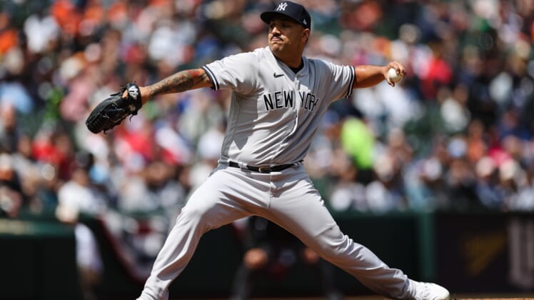 Apr 17, 2022; Baltimore, Maryland, USA; New York Yankees starting pitcher Nestor Cortes (65) pitches against the Baltimore Orioles during the first inning at Oriole Park at Camden Yards. Mandatory Credit: Scott Taetsch-USA TODAY Sports