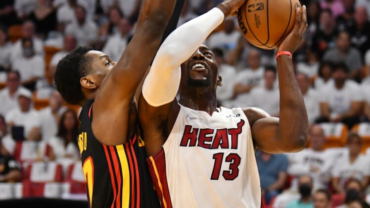 Apr 17, 2022; Miami, Florida, USA; Miami Heat center Bam Adebayo (13) goes up for a shot against Atlanta Hawks forward Onyeka Okongwu (17) during the first half of game one of the first round for the 2022 NBA playoffs at FTX Arena. Mandatory Credit: Jim Rassol-USA TODAY Sports