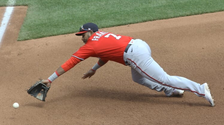 Apr 17, 2022; Pittsburgh, Pennsylvania, USA;  Washington Nationals third baseman Maikel Franco (7) fields a ground ball for an out on Pittsburgh Pirates shortstop Diego Castillo (not pictured) during the fourth inning at PNC Park. Mandatory Credit: Charles LeClaire-USA TODAY Sports