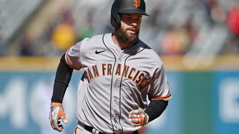 Apr 17, 2022; Cleveland, Ohio, USA; San Francisco Giants designated hitter Brandon Belt (9) rounds the bases after hitting a home run during the seventh inning against the Cleveland Guardians at Progressive Field. Mandatory Credit: Ken Blaze-USA TODAY Sports