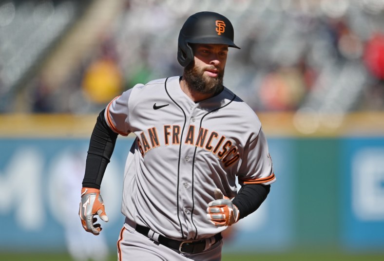 Apr 17, 2022; Cleveland, Ohio, USA; San Francisco Giants designated hitter Brandon Belt (9) rounds the bases after hitting a home run during the seventh inning against the Cleveland Guardians at Progressive Field. Mandatory Credit: Ken Blaze-USA TODAY Sports