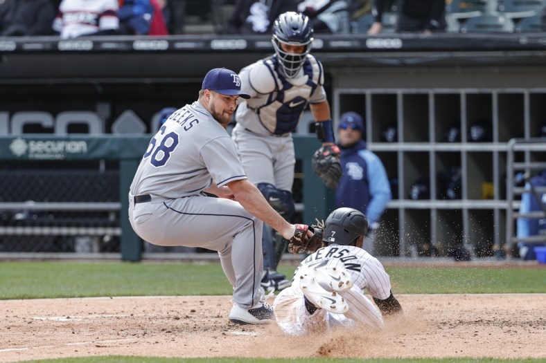 Apr 17, 2022; Chicago, Illinois, USA; Tampa Bay Rays relief pitcher Jalen Beeks (68) tags out at home plate Chicago White Sox shortstop Tim Anderson (7) during the fifth inning at Guaranteed Rate Field. Mandatory Credit: Kamil Krzaczynski-USA TODAY Sports