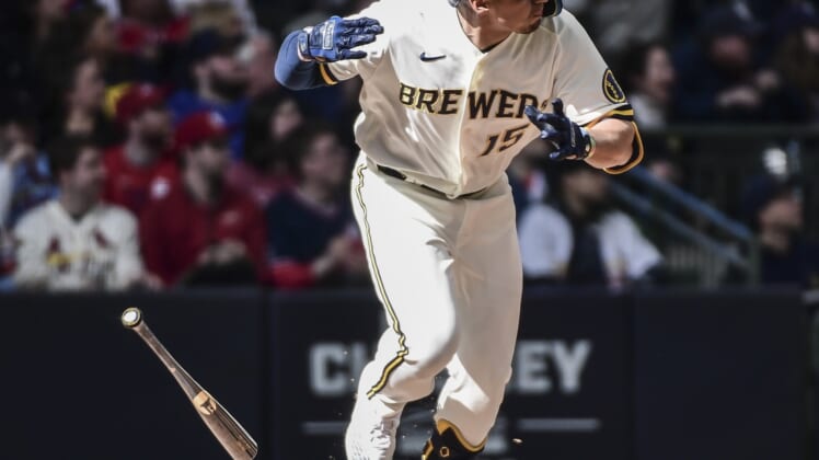 Apr 17, 2022; Milwaukee, Wisconsin, USA;  Milwaukee Brewers center fielder Tyrone Taylor (15) hits a double to drive in 2 runs in the seventh inning  against the St. Louis Cardinals at American Family Field. Mandatory Credit: Benny Sieu-USA TODAY Sports