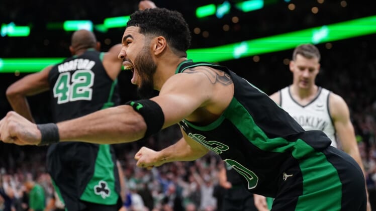 Apr 17, 2022; Boston, Massachusetts, USA; Boston Celtics forward Jayson Tatum (0) reacts after making the game winning basket against the Brooklyn Nets in the second half during game one of the first round for the 2022 NBA playoffs at TD Garden. Mandatory Credit: David Butler II-USA TODAY Sports