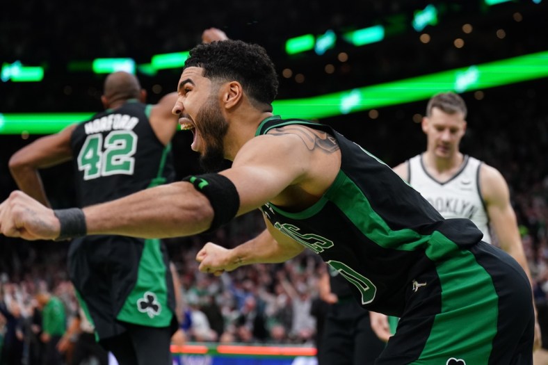 Apr 17, 2022; Boston, Massachusetts, USA; Boston Celtics forward Jayson Tatum (0) reacts after making the game winning basket against the Brooklyn Nets in the second half during game one of the first round for the 2022 NBA playoffs at TD Garden. Mandatory Credit: David Butler II-USA TODAY Sports
