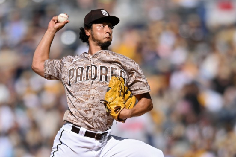 Apr 17, 2022; San Diego, California, USA; San Diego Padres starting pitcher Yu Darvish (11) throws a pitch against the Atlanta Braves during the first inning at Petco Park. Mandatory Credit: Orlando Ramirez-USA TODAY Sports