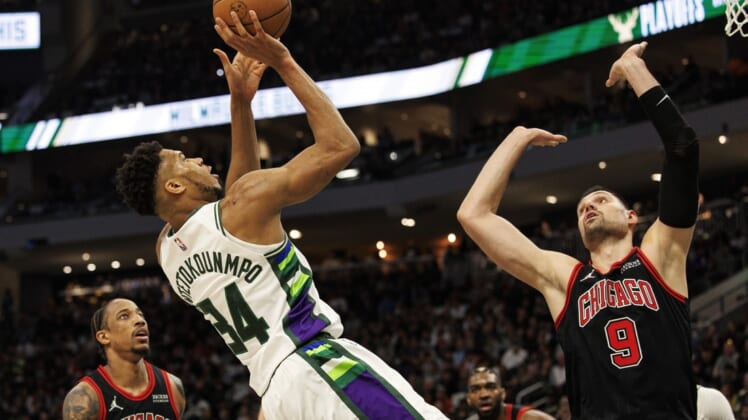 Apr 17, 2022; Milwaukee, Wisconsin, USA; Milwaukee Bucks forward Giannis Antetokounmpo (34) drives for the basket against Chicago Bulls center Nikola Vucevic (9) during the second quarter during game one of the first round for the 2022 NBA playoffs at Fiserv Forum. Mandatory Credit: Jeff Hanisch-USA TODAY Sports