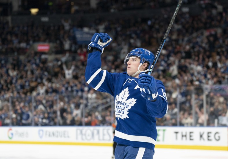 Apr 17, 2022; Toronto, Ontario, CAN; Toronto Maple Leafs right wing Mitchell Marner (16) celebrates scoring a goal during the first period against the New York Islanders at Scotiabank Arena. Mandatory Credit: Nick Turchiaro-USA TODAY Sports