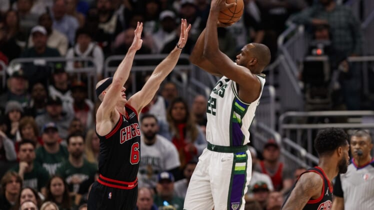 Apr 17, 2022; Milwaukee, Wisconsin, USA; Milwaukee Bucks forward Khris Middleton (22) shoots against Chicago Bulls guard Alex Caruso (6) during the fourth quarter during game one of the first round for the 2022 NBA playoffs at Fiserv Forum. Mandatory Credit: Jeff Hanisch-USA TODAY Sports