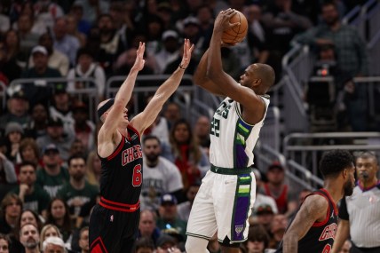 Apr 17, 2022; Milwaukee, Wisconsin, USA; Milwaukee Bucks forward Khris Middleton (22) shoots against Chicago Bulls guard Alex Caruso (6) during the fourth quarter during game one of the first round for the 2022 NBA playoffs at Fiserv Forum. Mandatory Credit: Jeff Hanisch-USA TODAY Sports
