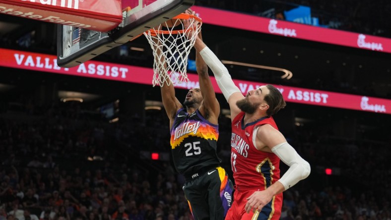 Apr 17, 2022; Phoenix, Arizona, USA; New Orleans Pelicans center Jonas Valanciunas (17) fouls Phoenix Suns forward Mikal Bridges (25) during the second half of game one of the first round for the 2022 NBA playoffs at Footprint Center. Mandatory Credit: Joe Camporeale-USA TODAY Sports