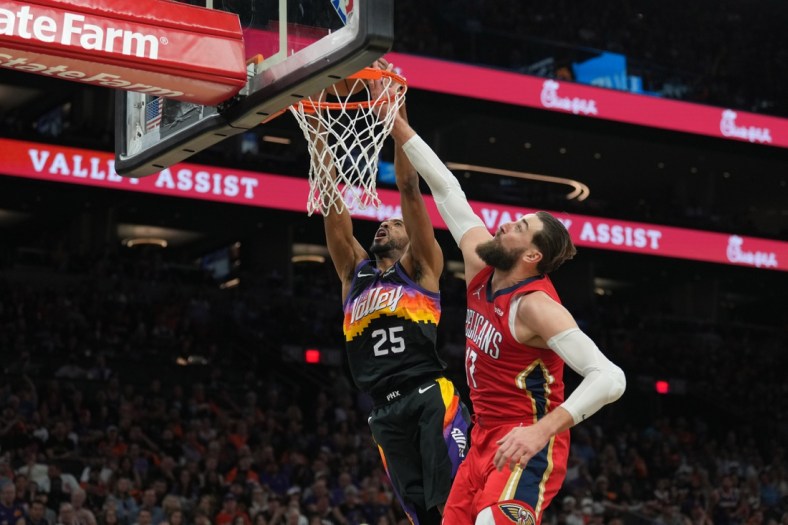 Apr 17, 2022; Phoenix, Arizona, USA; New Orleans Pelicans center Jonas Valanciunas (17) fouls Phoenix Suns forward Mikal Bridges (25) during the second half of game one of the first round for the 2022 NBA playoffs at Footprint Center. Mandatory Credit: Joe Camporeale-USA TODAY Sports