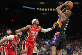 Apr 17, 2022; Phoenix, Arizona, USA; Phoenix Suns guard Chris Paul (3) shoots over New Orleans Pelicans guard Devonte' Graham (4) during the second half of game one of the first round for the 2022 NBA playoffs at Footprint Center. Mandatory Credit: Joe Camporeale-USA TODAY Sports
