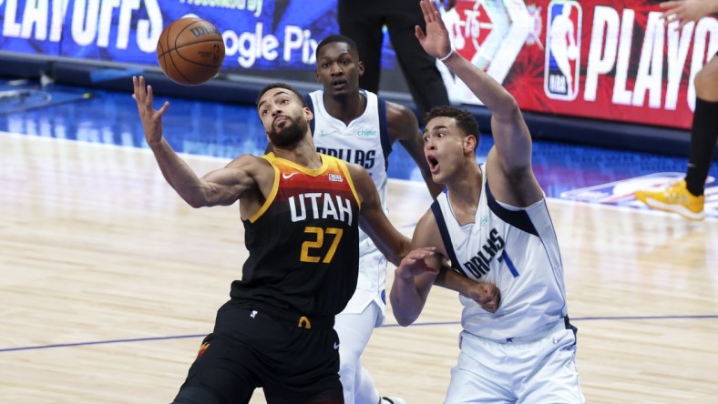 Apr 18, 2022; Dallas, Texas, USA; Utah Jazz center Rudy Gobert (27) grabs the ball in front of Dallas Mavericks center Dwight Powell (7) during the first quarter in game two of the first round of the 2022 NBA playoffs at American Airlines Center. Mandatory Credit: Kevin Jairaj-USA TODAY Sports