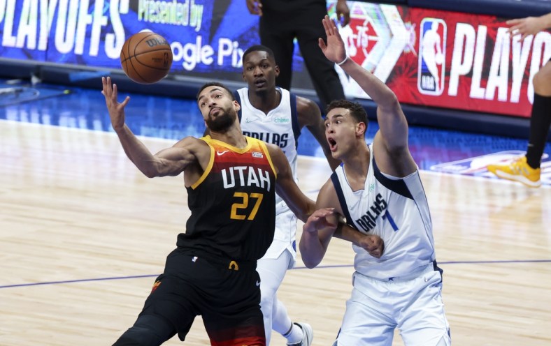 Apr 18, 2022; Dallas, Texas, USA; Utah Jazz center Rudy Gobert (27) grabs the ball in front of Dallas Mavericks center Dwight Powell (7) during the first quarter in game two of the first round of the 2022 NBA playoffs at American Airlines Center. Mandatory Credit: Kevin Jairaj-USA TODAY Sports