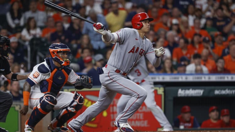 Apr 18, 2022; Houston, Texas, USA; Los Angeles Angels designated hitter Shohei Ohtani (17) hits a single during the third inning against the Houston Astros at Minute Maid Park. Mandatory Credit: Troy Taormina-USA TODAY Sports