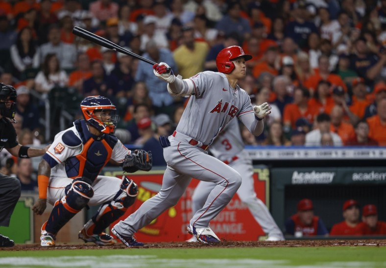 Apr 18, 2022; Houston, Texas, USA; Los Angeles Angels designated hitter Shohei Ohtani (17) hits a single during the third inning against the Houston Astros at Minute Maid Park. Mandatory Credit: Troy Taormina-USA TODAY Sports