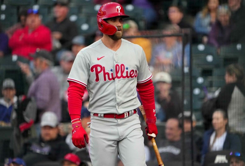 Apr 18, 2022; Denver, Colorado, USA; Philadelphia Phillies right fielder Bryce Harper (3) on deck in the first inning against the Colorado Rockies at Coors Field. Mandatory Credit: Ron Chenoy-USA TODAY Sports