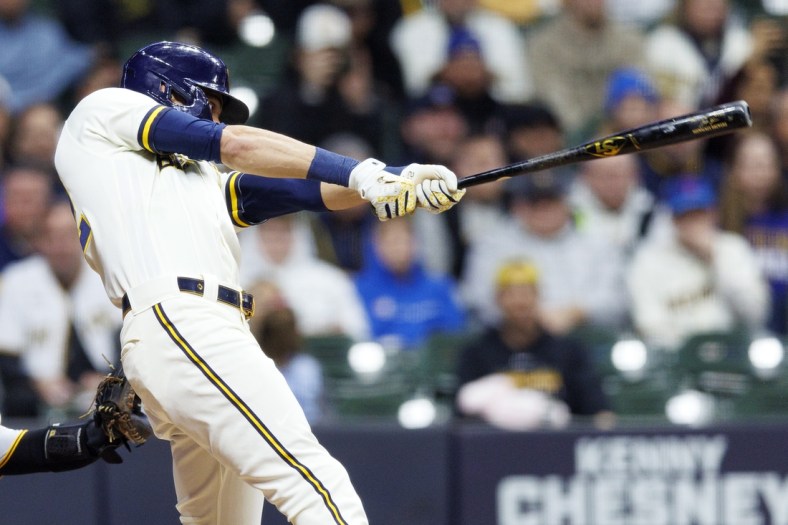 Apr 18, 2022; Milwaukee, Wisconsin, USA;  Milwaukee Brewers left fielder Christian Yelich (22) hits a grand slam home run during the fourth inning against the Pittsburgh Pirates at American Family Field. Mandatory Credit: Jeff Hanisch-USA TODAY Sports