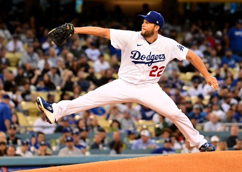 Apr 18, 2022; Los Angeles, California, USA; Los Angeles Dodgers starting pitcher Clayton Kershaw (22) throws during the first inning against the Atlanta Braves at Dodger Stadium. Mandatory Credit: Richard Mackson-USA TODAY Sports