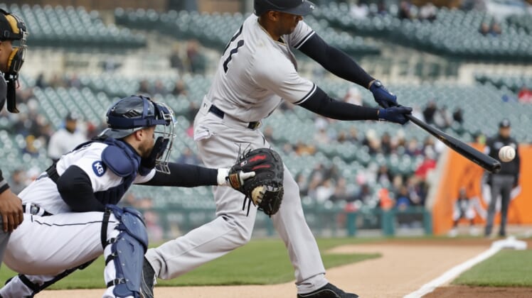 Apr 19, 2022; Detroit, Michigan, USA; New York Yankees center fielder Aaron Hicks (31) hits a single in the first inning against the Detroit Tigers at Comerica Park. Mandatory Credit: Rick Osentoski-USA TODAY Sports