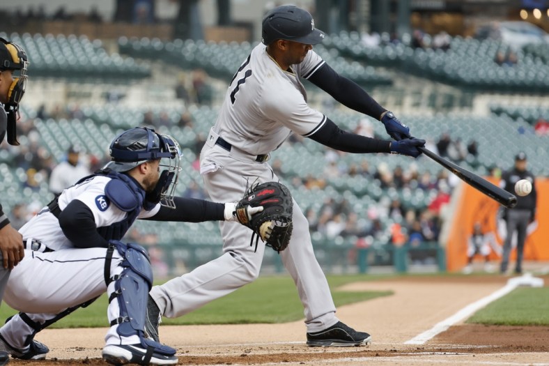Apr 19, 2022; Detroit, Michigan, USA; New York Yankees center fielder Aaron Hicks (31) hits a single in the first inning against the Detroit Tigers at Comerica Park. Mandatory Credit: Rick Osentoski-USA TODAY Sports