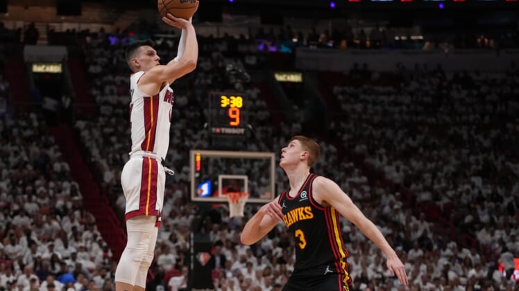 Apr 19, 2022; Miami, Florida, USA; Miami Heat guard Tyler Herro (14) puts up a shot over Atlanta Hawks guard Kevin Huerter (3) during the first half in game two of the first round for the 2022 NBA playoffs at FTX Arena. Mandatory Credit: Jasen Vinlove-USA TODAY Sports