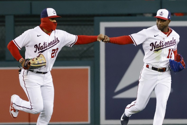 Apr 19, 2022; Washington, District of Columbia, USA; Washington Nationals center fielder Victor Robles (16) celebrates with Nationals left fielder Juan Soto (22) at the end of the fifth inning against the Arizona Diamondbacks at Nationals Park. Mandatory Credit: Geoff Burke-USA TODAY Sports