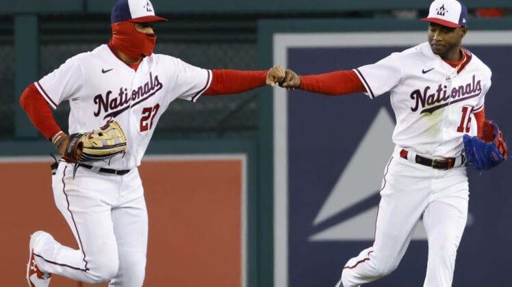 Apr 19, 2022; Washington, District of Columbia, USA; Washington Nationals center fielder Victor Robles (16) celebrates with Nationals left fielder Juan Soto (22) at the end of the fifth inning against the Arizona Diamondbacks at Nationals Park. Mandatory Credit: Geoff Burke-USA TODAY Sports