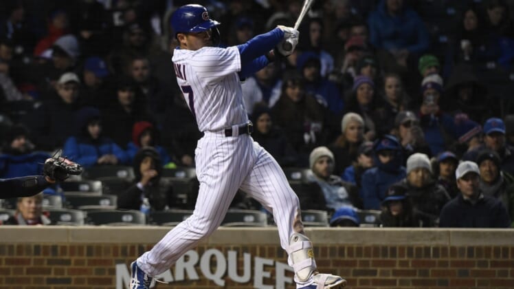 Apr 19, 2022; Chicago, Illinois, USA; Chicago Cubs right fielder Seiya Suzuki (27) bats during the third inning against the Tampa Bay Rays at Wrigley Field. Mandatory Credit: Matt Marton-USA TODAY Sports