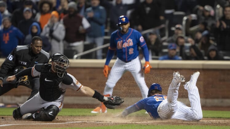 Apr 19, 2022; New York City, New York, USA; New York Mets first baseman Pete Alonzo (20) slides into home plate safely with San Francisco Giants catcher Curt Casali (2) missing the tag during the third inning at Citi Field. Mandatory Credit: Gregory Fisher-USA TODAY Sports