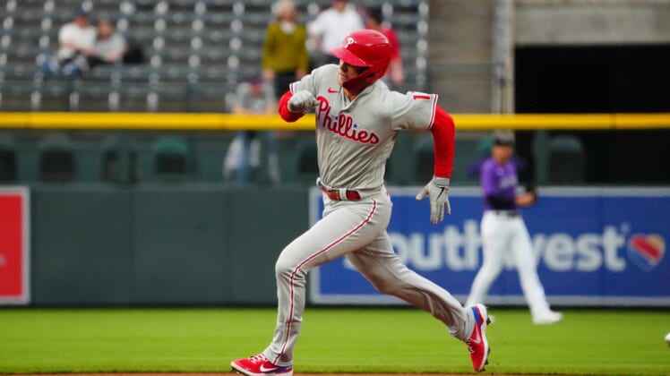 Apr 19, 2022; Denver, Colorado, USA; Philadelphia Phillies first baseman Rhys Hoskins (17) runs out a triple in the first inning against the against the Colorado Rockies at Coors Field. Mandatory Credit: Ron Chenoy-USA TODAY Sports