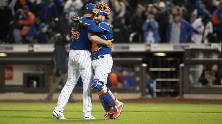 Apr 19, 2022; New York City, New York, USA; New York Mets catcher Tomas Nido (3) hugs New York Mets pitcher Trevor May (65) to congratulate him for the save after the ninth inning against the San Francisco Giants at Citi Field. Mandatory Credit: Gregory Fisher-USA TODAY Sports