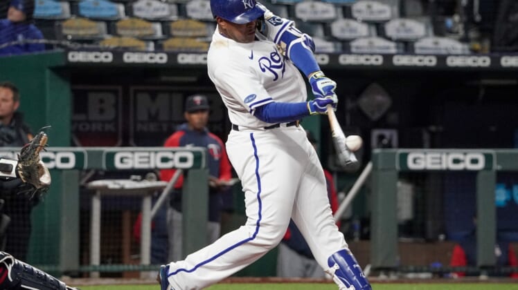 Apr 19, 2022; Kansas City, Missouri, USA; Kansas City Royals designated hitter Salvador Perez (13) connects for a  solo home run against the Minnesota Twins in the sixth inning at Kauffman Stadium. Mandatory Credit: Denny Medley-USA TODAY Sports