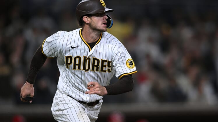 Apr 19, 2022; San Diego, California, USA; San Diego Padres right fielder Wil Myers (5) watches his RBI double against the Cincinnati Reds during the fourth inning at Petco Park. Mandatory Credit: Orlando Ramirez-USA TODAY Sports