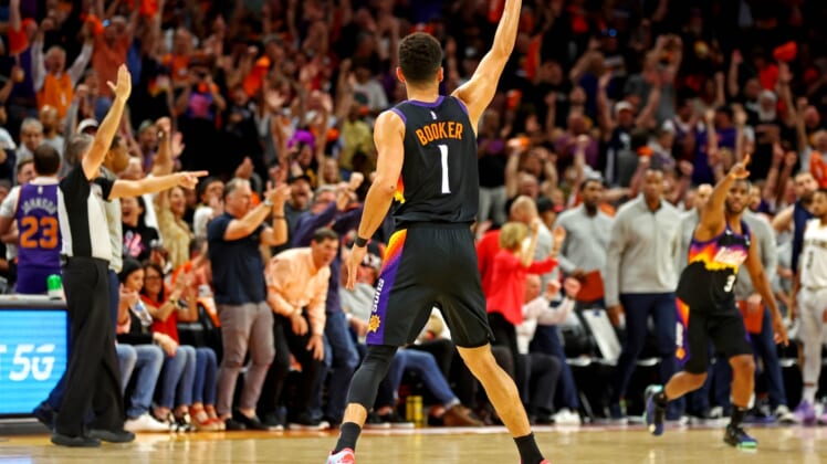 Apr 19, 2022; Phoenix, Arizona, USA; Phoenix Suns guard Devin Booker (1) reacts after a play during the second quarter against the New Orleans Pelicans during game one of the first round for the 2022 NBA playoffs at Footprint Center. Mandatory Credit: Mark J. Rebilas-USA TODAY Sports