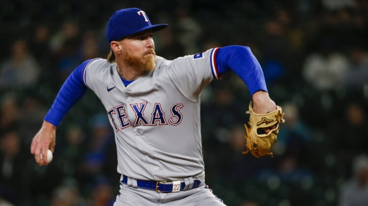 Apr 19, 2022; Seattle, Washington, USA; Texas Rangers starting pitcher Jon Gray (22) throws against the Seattle Mariners during the fourth inning at T-Mobile Park. Mandatory Credit: Joe Nicholson-USA TODAY Sports