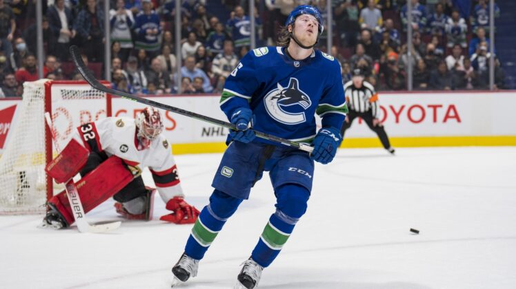 Apr 19, 2022; Vancouver, British Columbia, CAN; Ottawa Senators goalie Filip Gustavsson (32) makes a save on Vancouver Canucks forward Brock Boeser (6) in the shootout at Rogers Arena. Ottawa won 4-3 in an overtime shootout. Mandatory Credit: Bob Frid-USA TODAY Sports