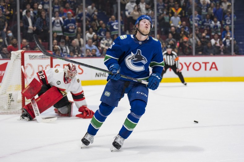 Apr 19, 2022; Vancouver, British Columbia, CAN; Ottawa Senators goalie Filip Gustavsson (32) makes a save on Vancouver Canucks forward Brock Boeser (6) in the shootout at Rogers Arena. Ottawa won 4-3 in an overtime shootout. Mandatory Credit: Bob Frid-USA TODAY Sports