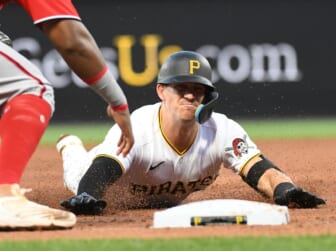Apr 14, 2022; Pittsburgh, Pennsylvania, USA; Pittsburgh Pirates player Kevin Newman (27) is tagged out trying to get a triple in the third inning by Washington Nationals third baseman Maikel Franco (7) at PNC Park. Mandatory Credit: Philip G. Pavely-USA TODAY Sports