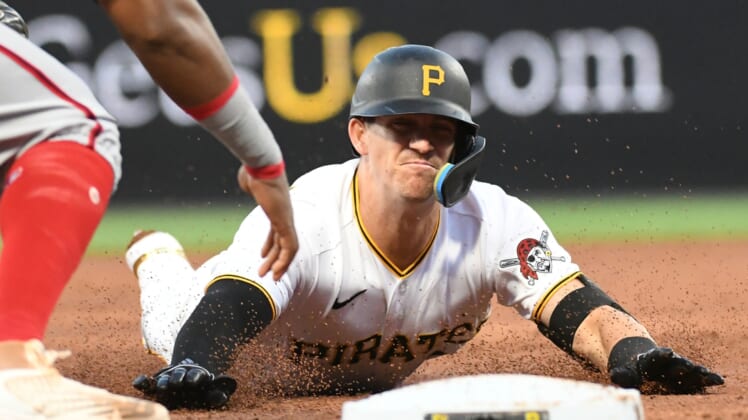 Apr 14, 2022; Pittsburgh, Pennsylvania, USA; Pittsburgh Pirates player Kevin Newman (27) is tagged out trying to get a triple in the third inning by Washington Nationals third baseman Maikel Franco (7) at PNC Park. Mandatory Credit: Philip G. Pavely-USA TODAY Sports