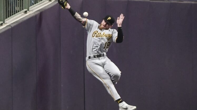Apr 20, 2022; Milwaukee, Wisconsin, USA;  Pittsburgh Pirates left fielder Ben Gamel (18) can't catch a foul ball hit by Milwaukee Brewers third baseman Jace Peterson (not pictured) in the fifth inning at American Family Field. Mandatory Credit: Benny Sieu-USA TODAY Sports