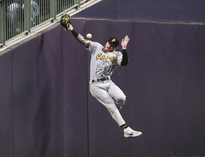Apr 20, 2022; Milwaukee, Wisconsin, USA;  Pittsburgh Pirates left fielder Ben Gamel (18) can't catch a foul ball hit by Milwaukee Brewers third baseman Jace Peterson (not pictured) in the fifth inning at American Family Field. Mandatory Credit: Benny Sieu-USA TODAY Sports