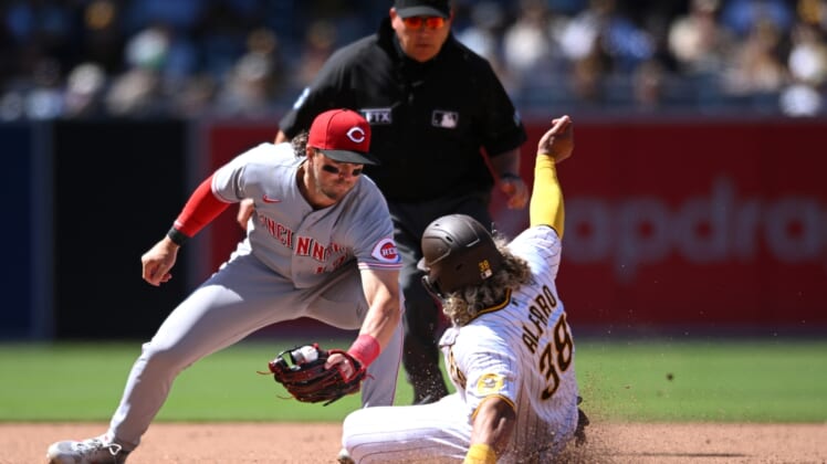 Apr 20, 2022; San Diego, California, USA; San Diego Padres catcher Jorge Alfaro (38) steals second base ahead of the tag by Cincinnati Reds shortstop Kyle Farmer (17) during the fifth inning at Petco Park. Mandatory Credit: Orlando Ramirez-USA TODAY Sports